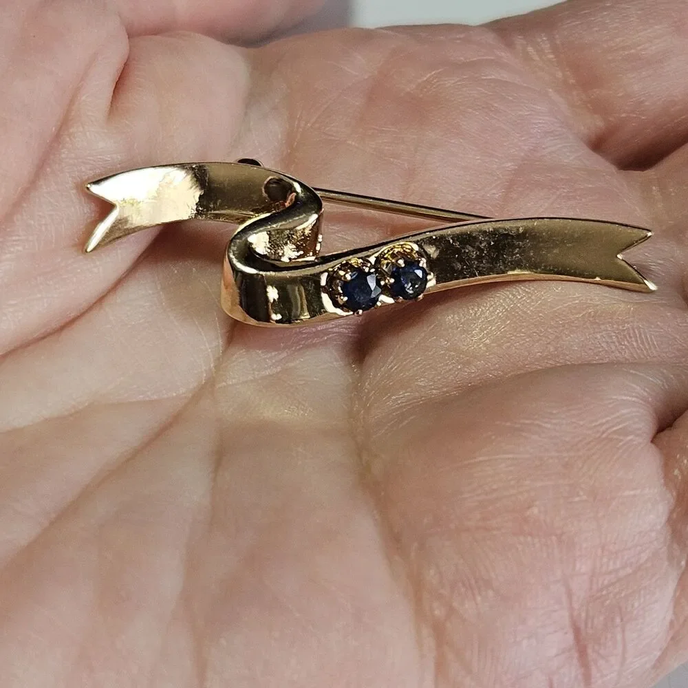 Avon Gold Tone Blue Stone Ribbon Pin Signed 1985